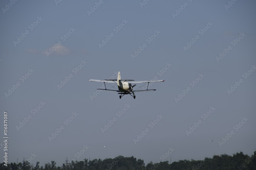 The spraying of fertilizers and pesticides on the field with the aircraft. The spraying of fertilizers and pesticides on the field with the aircraft.