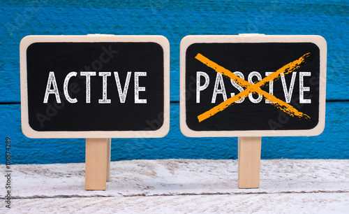 Obraz na plátne Active instead of Passive - two little chalkboards on blue background