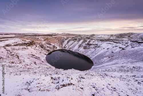 Kerid (or Kerith) volcanic crater lake on the touristic golden circle route in Iceland in winter