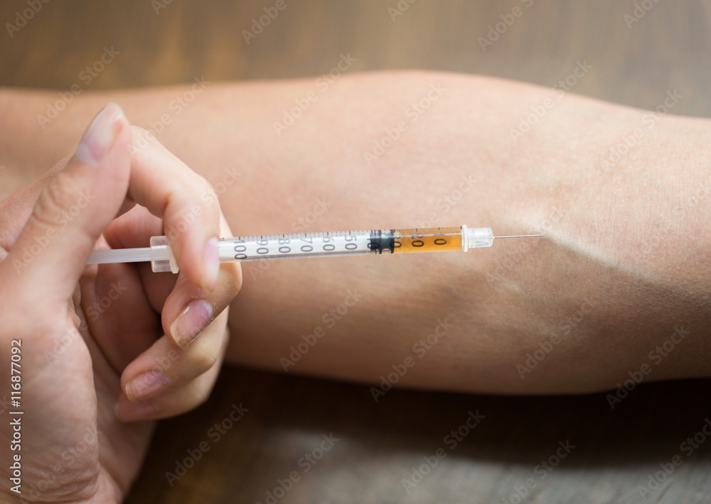 close up of addict hand making drug injection close up of addict hand making drug injection