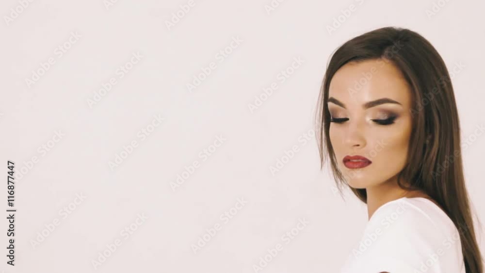 Passionate pretty girl posing to the camera on white background Passionate pretty girl posing to the camera on white background