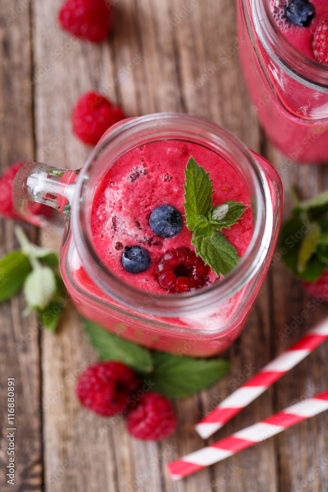 Top view on detox berry smoothie in glass jar with mint. Top view on detox berry smoothie in glass jar with mint.