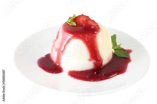 Panna cotta on plate with strawberry jam
