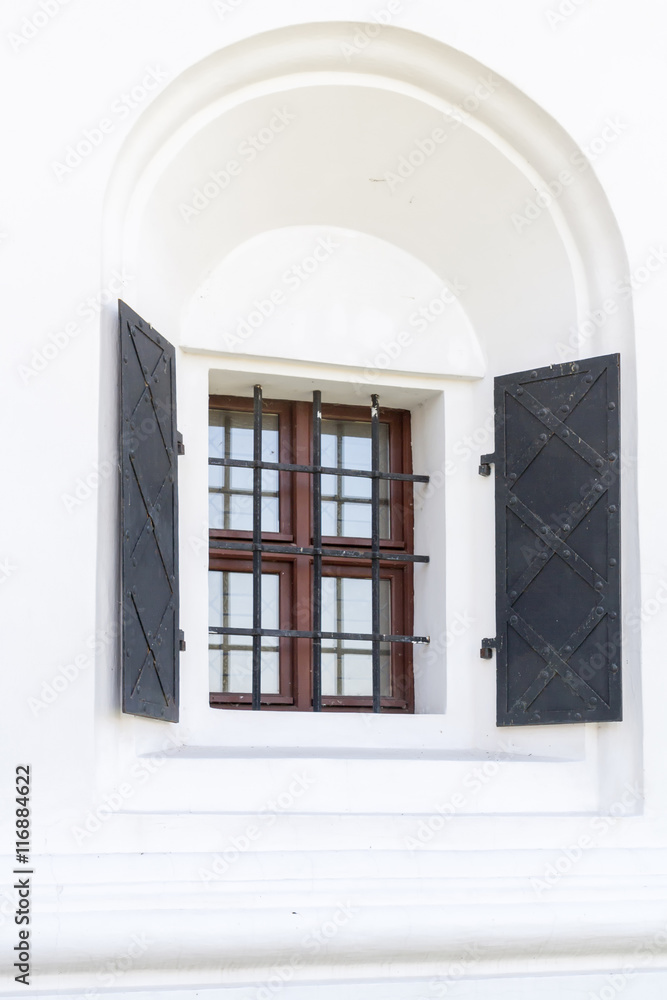 Obraz premium Window with metal hinged shutters