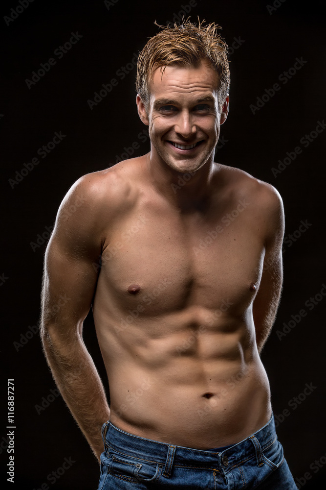 Fototapeta premium Guy with nude torso in studio