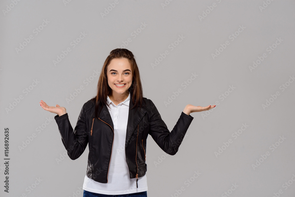 Young beautiful girl pointing hands in side over purple background. Young beautiful girl pointing hands in side over purple background.