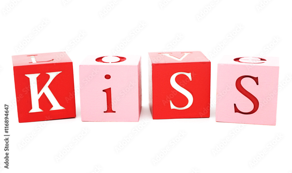 Valentine message. Isolated colored wood blocks, with the word kiss painted. Valentine message. Isolated colored wood blocks, with the word kiss painted.