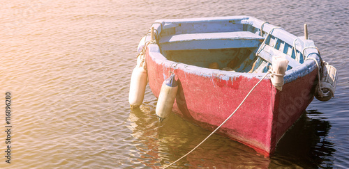 Canvas Print LIttle boat adrift on the water