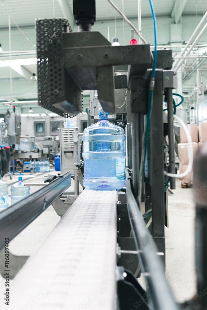 Water factory - Water bottling line for processing and bottling pure spring water into gallons.