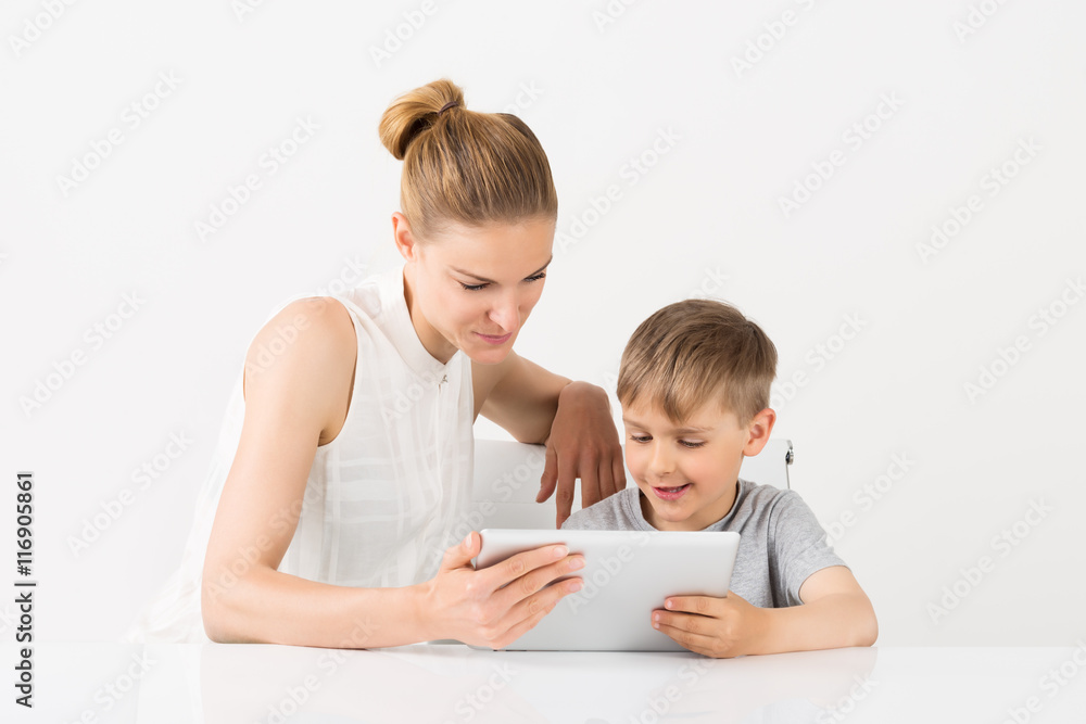 Mother And Son Using Digital Tablet Mother And Son Using Digital Tablet