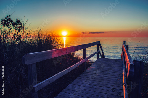 Konstfotografi Beautiful evening sunset landscape at Canadian Ontario lake Huron in Pinery Park, orange blue red sky sun