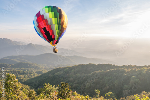 Colorful hot air balloon over mountain