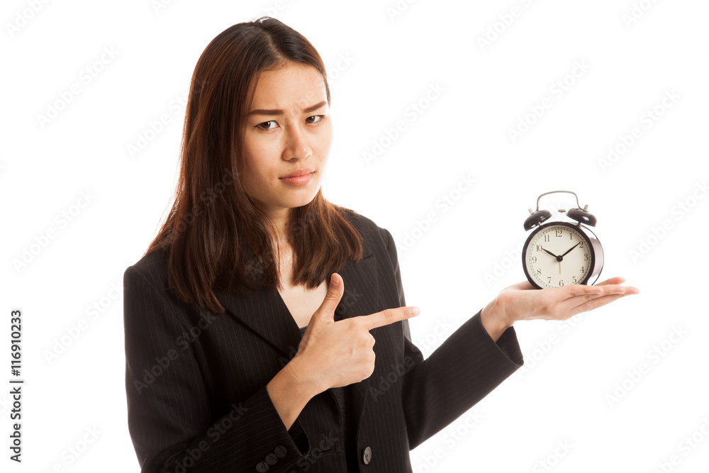 Angry young Asian woman point to a clock. Angry young Asian woman point to a clock.