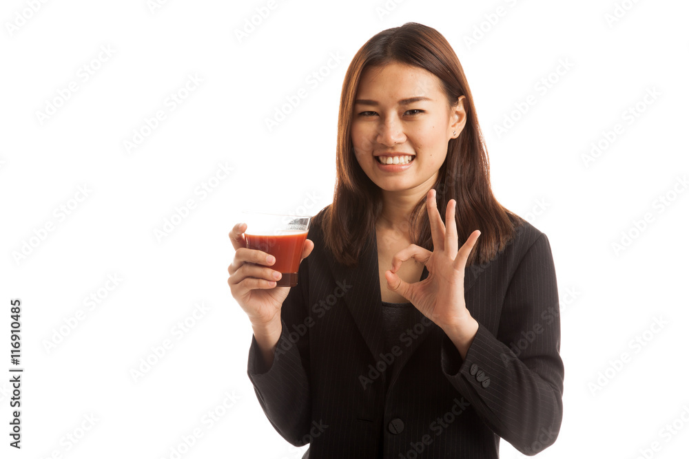Young Asian business woman show OK with tomato juice. Young Asian business woman show OK with tomato juice.