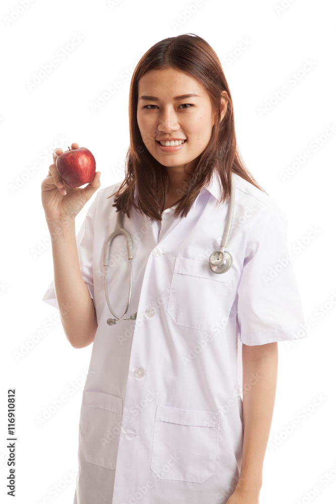 Young Asian female doctor smile show an apple. Young Asian female doctor smile show an apple.