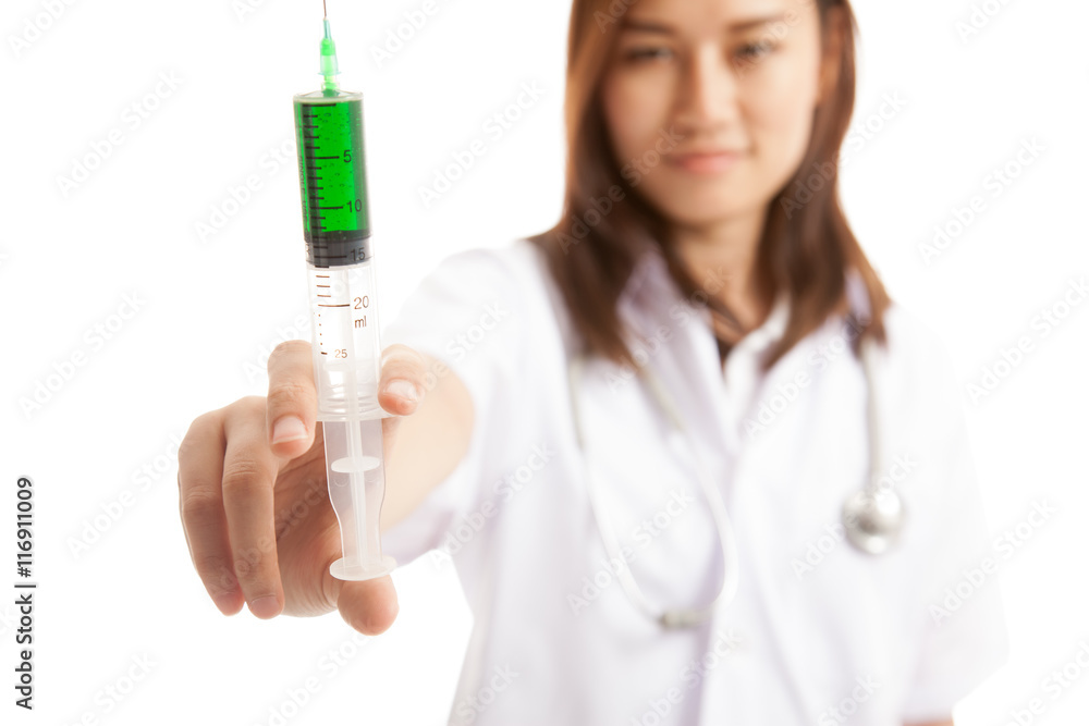 Young Asian female doctor smile hold syringe focus at syringe. Young Asian female doctor smile hold syringe focus at syringe.