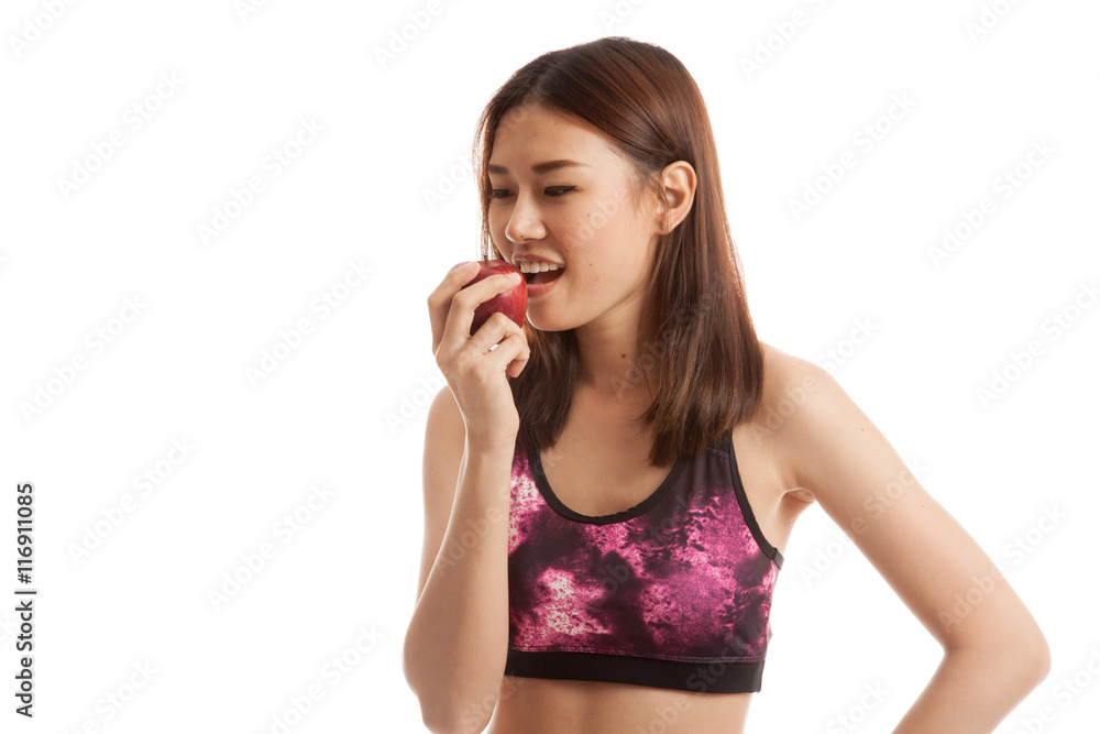 Beautiful Asian healthy girl eat red apple.