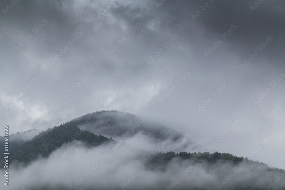 Storm clouds, and adter rain mist in the Romanian mountains, in summer Storm clouds, and adter rain mist in the Romanian mountains, in summer