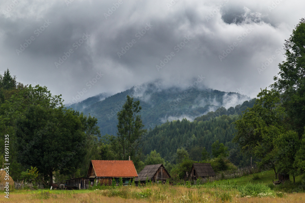 Mountain scenery in the Transylvanian Alps in summer, with mist clouds Mountain scenery in the Transylvanian Alps in summer, with mist clouds