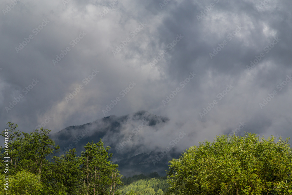 Mountain scenery in the Transylvanian Alps in summer, with mist clouds Mountain scenery in the Transylvanian Alps in summer, with mist clouds