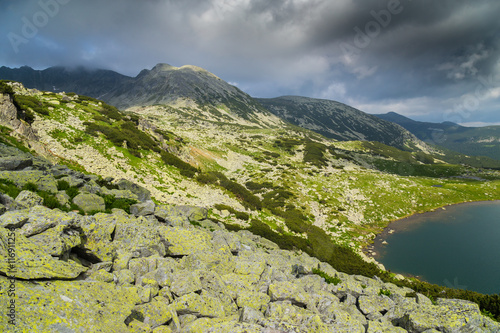 Fototapeta Naklejka Na Ścianę i Meble -  Mountain scenery in the Transylvanian Alps in summer, with mist clouds