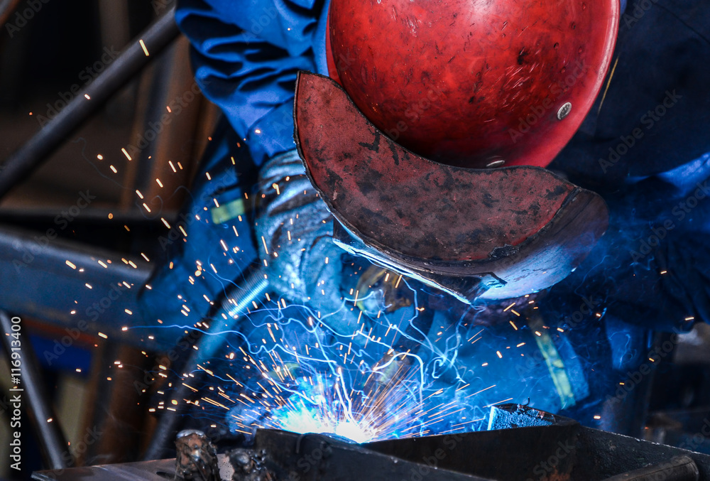 Arc welding of a steel in factory - obrazy, fototapety, plakaty 