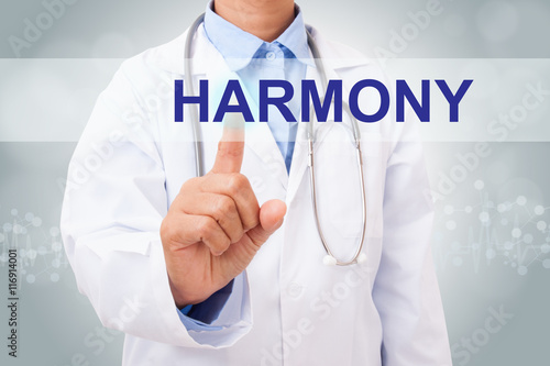 Doctor hand touching harmony sign on virtual screen. healthy concept