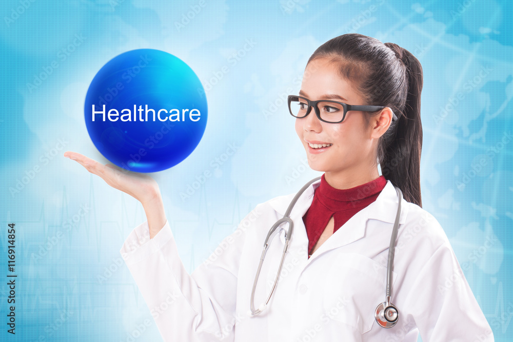 Female doctor holding blue crystal ball with healthcare sign on medical background. Female doctor holding blue crystal ball with healthcare sign on medical background.