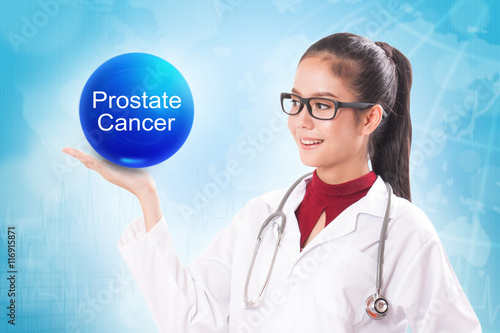 Female doctor holding blue crystal ball with prostate cancer sign on medical background.