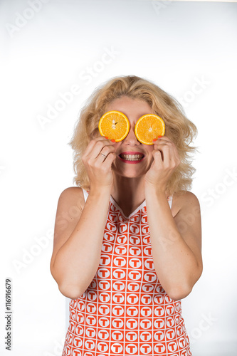 Young woman with orange/Young woman with orange isolated on a white background