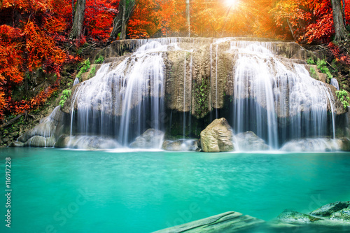 Amazing waterfall in autumn forest  