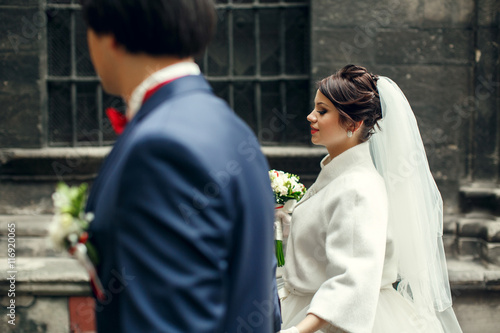 Bride looks gorgeous walking around the city with a groom
