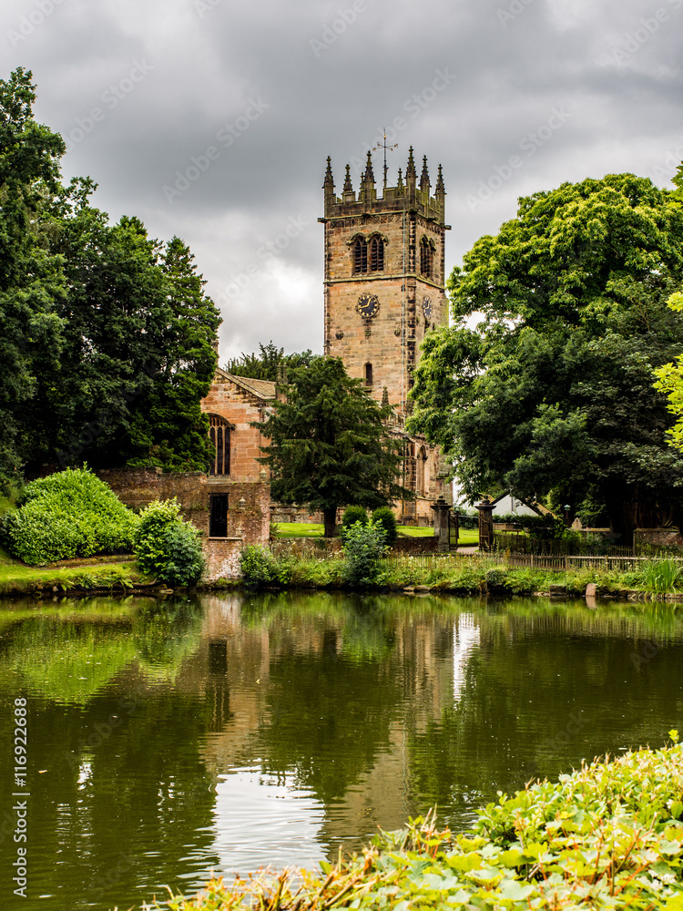 Gawesworth, Cheshire, UK. July 26th 2016. Attractive Gawesworth village church behind village pond at Gawesworthl, Cheshire, UK