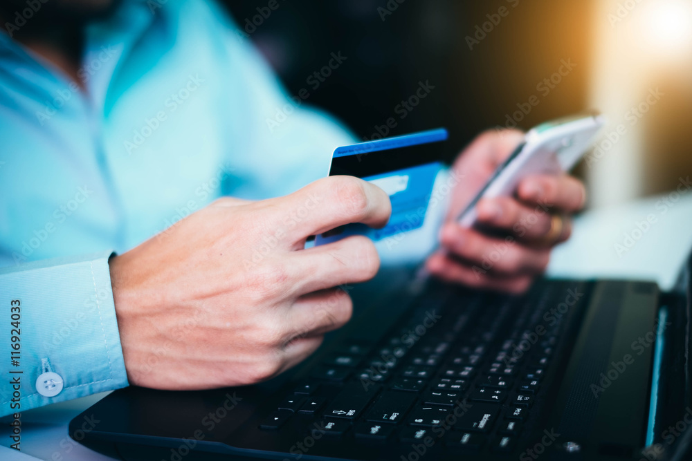 man hands with smartphone and credit card as online shopping man hands with smartphone and credit card as online shopping