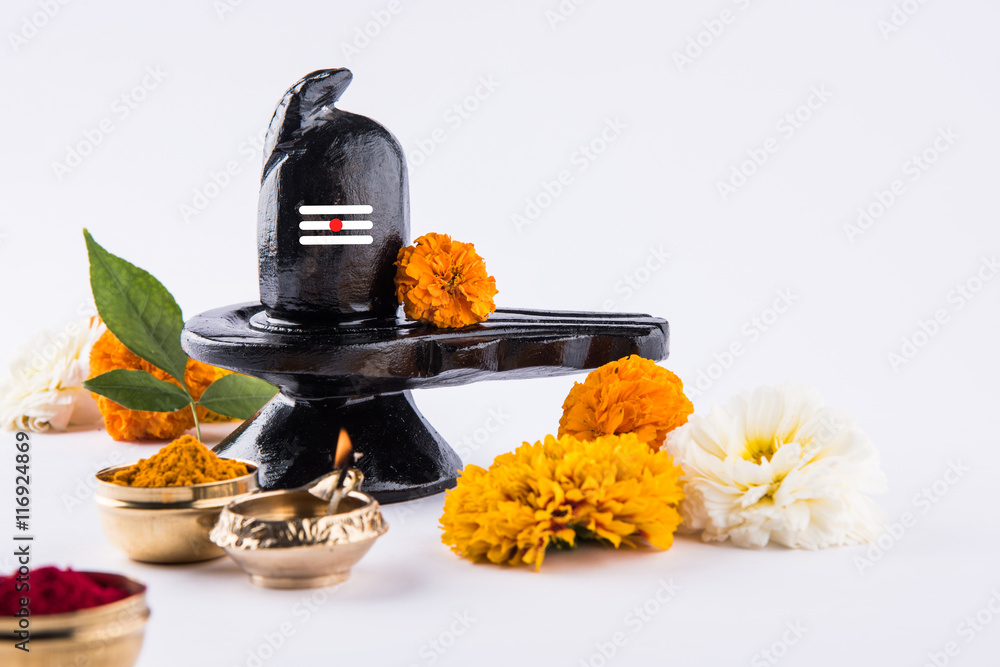 Shiva Linga made up of black stone decorated with flowers & bael leaf known  as Aegle