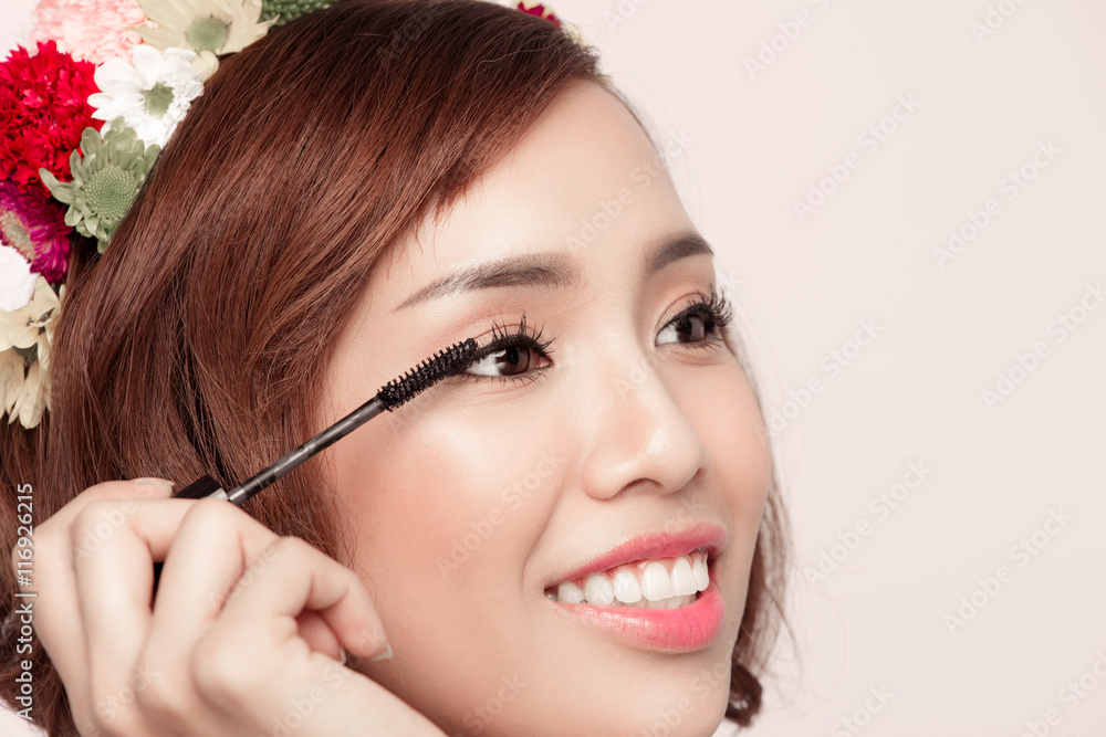 Sensual portrait of a spring woman with flowers on her head usin Sensual portrait of a spring woman with flowers on her head usin