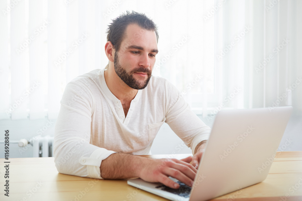 Man with laptop in the office Man with laptop in the office