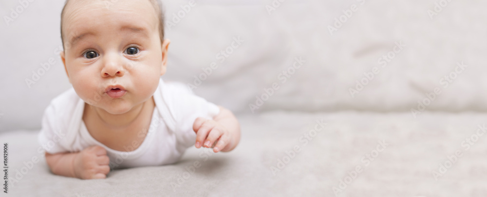 Cute baby on his tummy with copy space - obrazy, fototapety, plakaty 