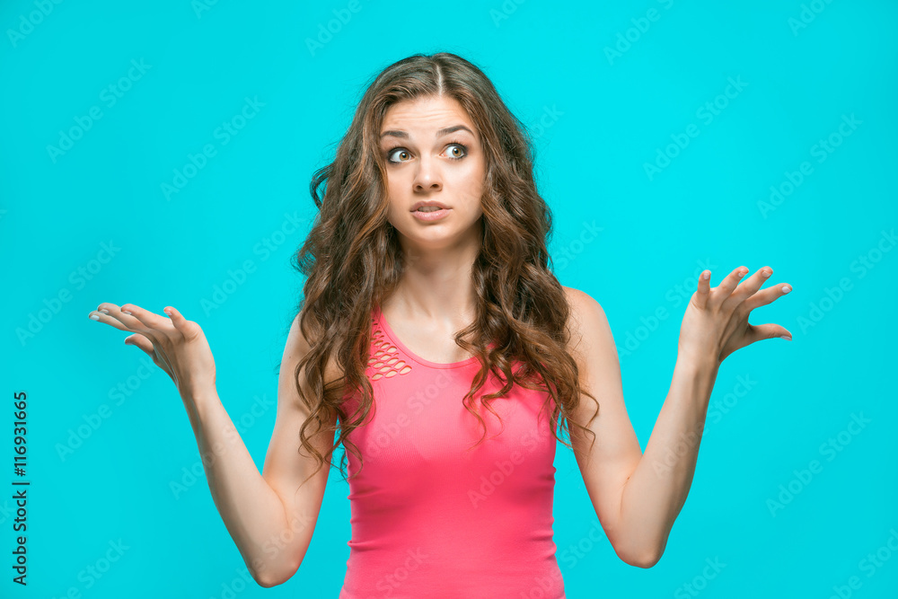 Portrait of young woman with shocked facial expression Portrait of young woman with shocked facial expression