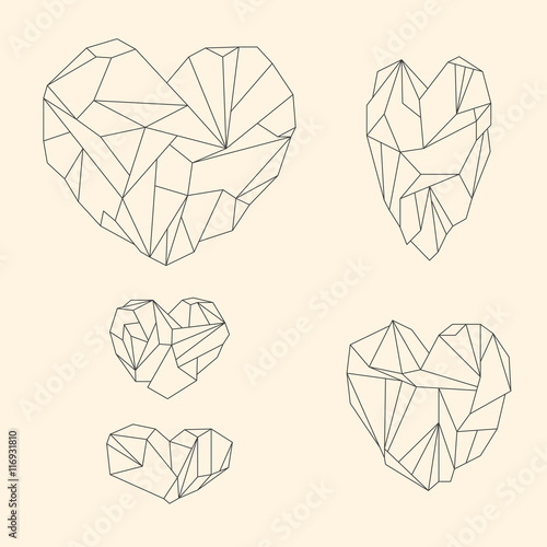 Set of mineral heart-shaped crystals on beige background