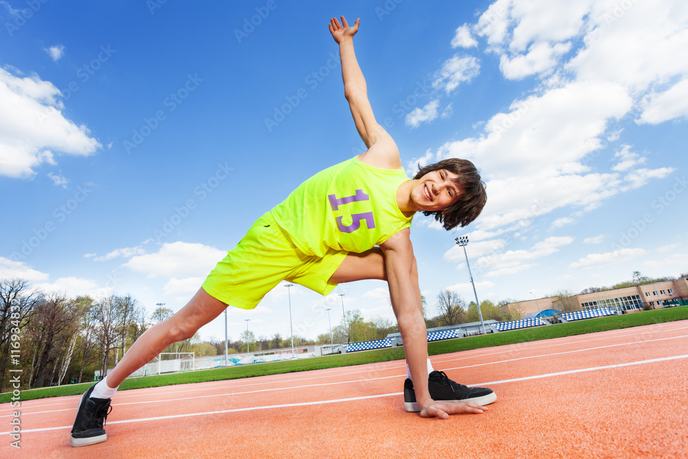 Active teenage athlete exercising outdoor