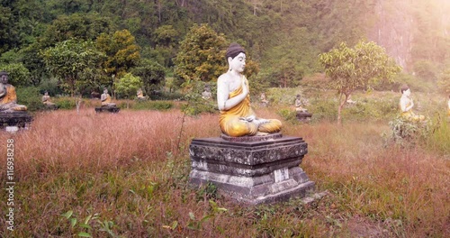 Ancient Buddhist site in Myanmar. Old statues of Buddhas photo