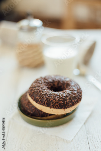 Breakfast in cafe with chocolate donut and coffee