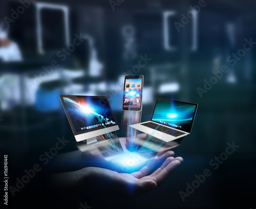 Tech devices and icons connected to businesswoman hand