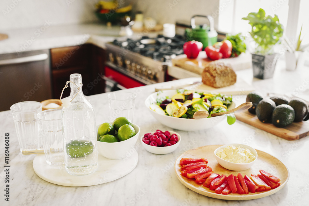A choice of prepared fresh salads on a kitchen counter. A choice of prepared fresh salads on a kitchen counter.