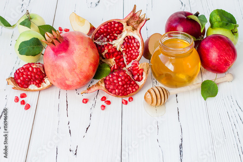 Apple and honey, traditional food of jewish New Year - Rosh Hashana. Copy space background photo