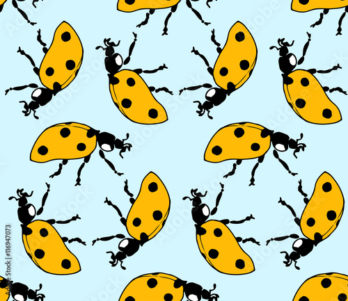 seamless pattern made from ladybugs on blue background
