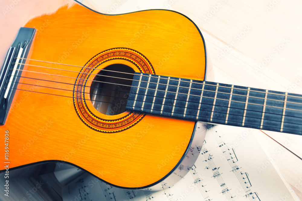 Yellow and orange guitar on a music notes. Yellow and orange guitar on a music notes.