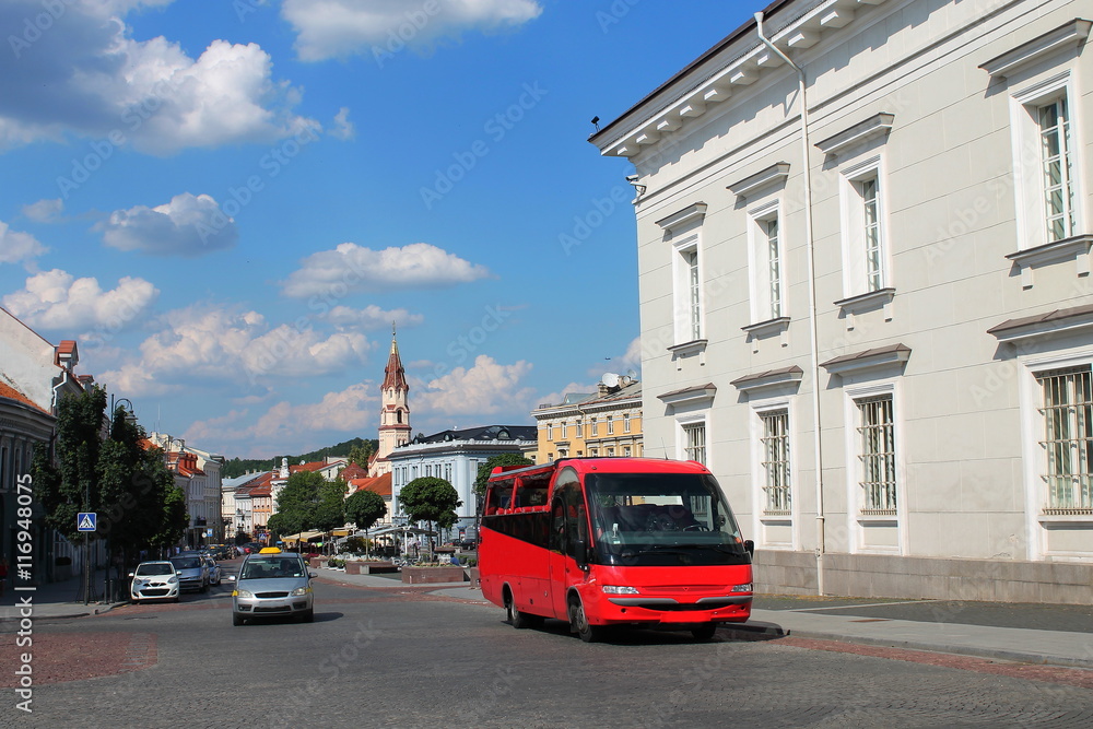 Fototapeta premium Red tourist bus in Old Town,Vilnius,L