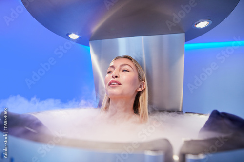 Fotografie Young woman in a cryo sauna chamber